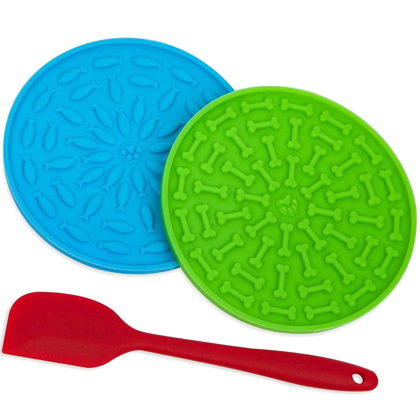 Two silicone mats with bone pattern and a red spatula on a white background