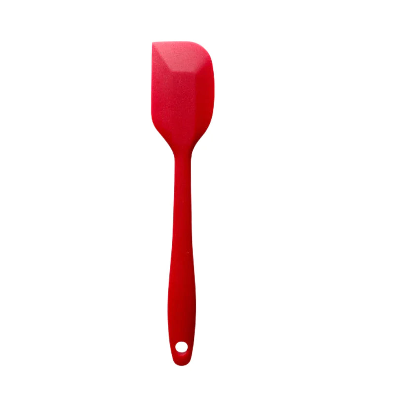 Red spatula on a white background