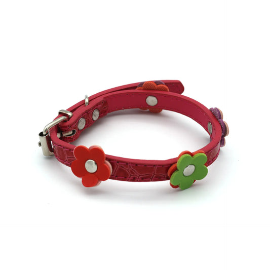 Red dog collar with floral decorations on a white background