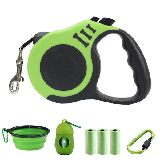 Green and black retractable dog leash set with additional green accessories on a white background