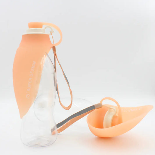 Clear water bottle with peach-colored cap and carrying strap on a light gray background