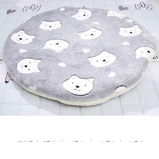 Round gray cushion with white bear patterns on a white background
