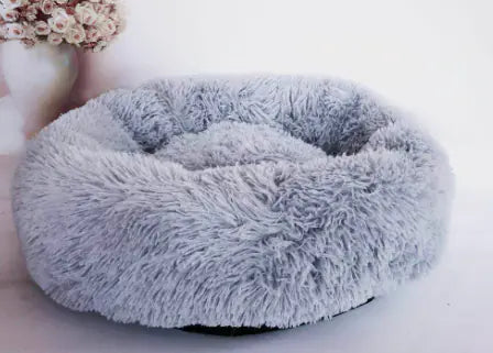 Fluffy gray pet bed on a white background